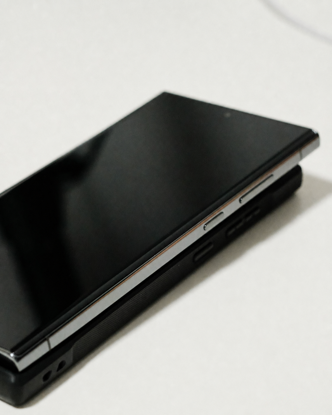 Close-up photo of a foldable smartphone on a white surface