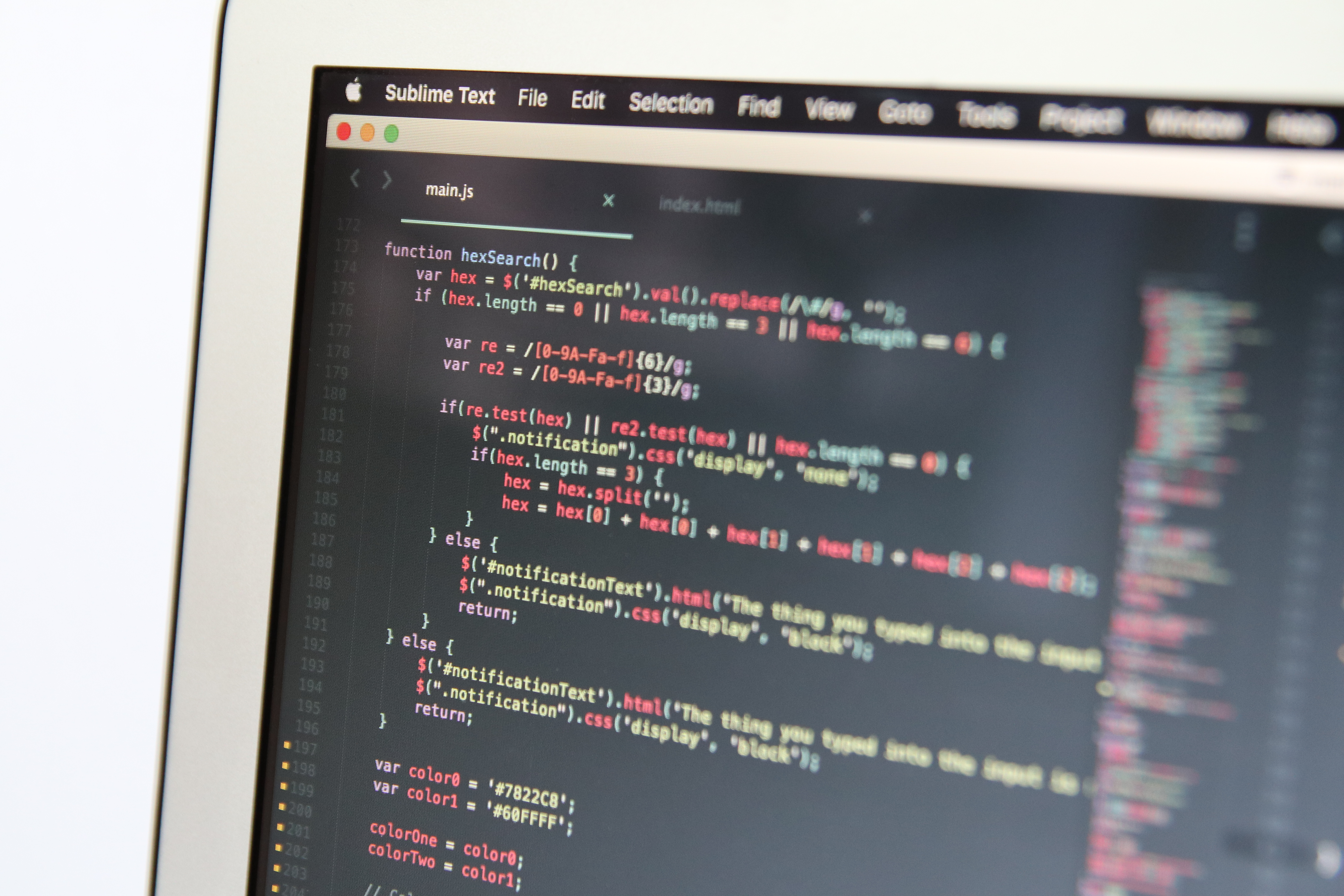 Source code open in an editor on a Mac; illustrative context for the macOS Tahoe 26.7 code leak.