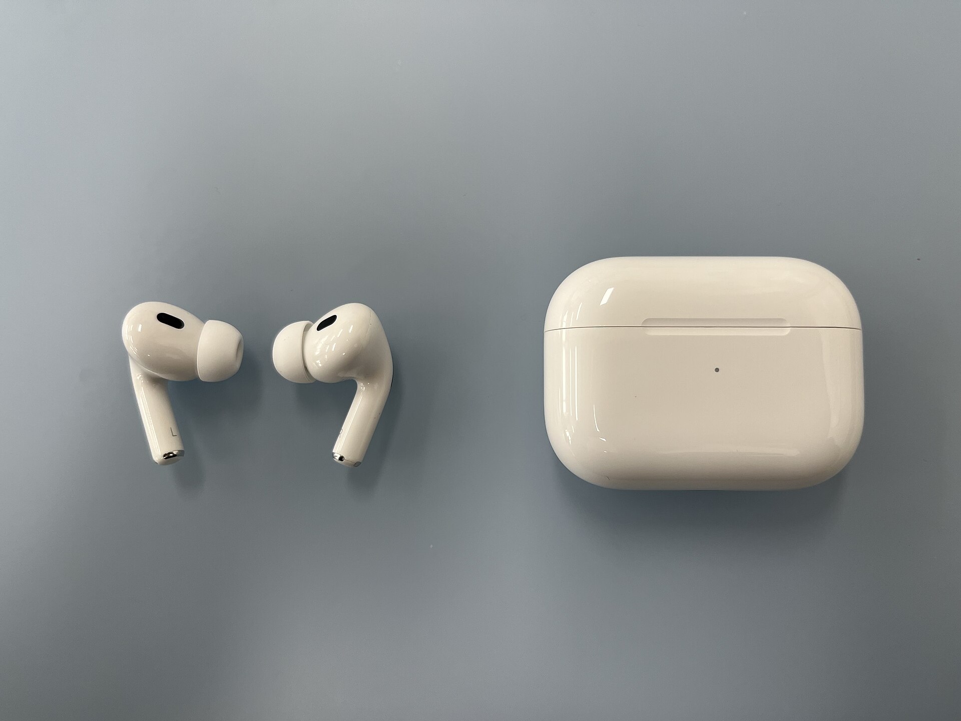 A woman wearing a wireless earbud; contextual image, not the rumored camera-equipped AirPods