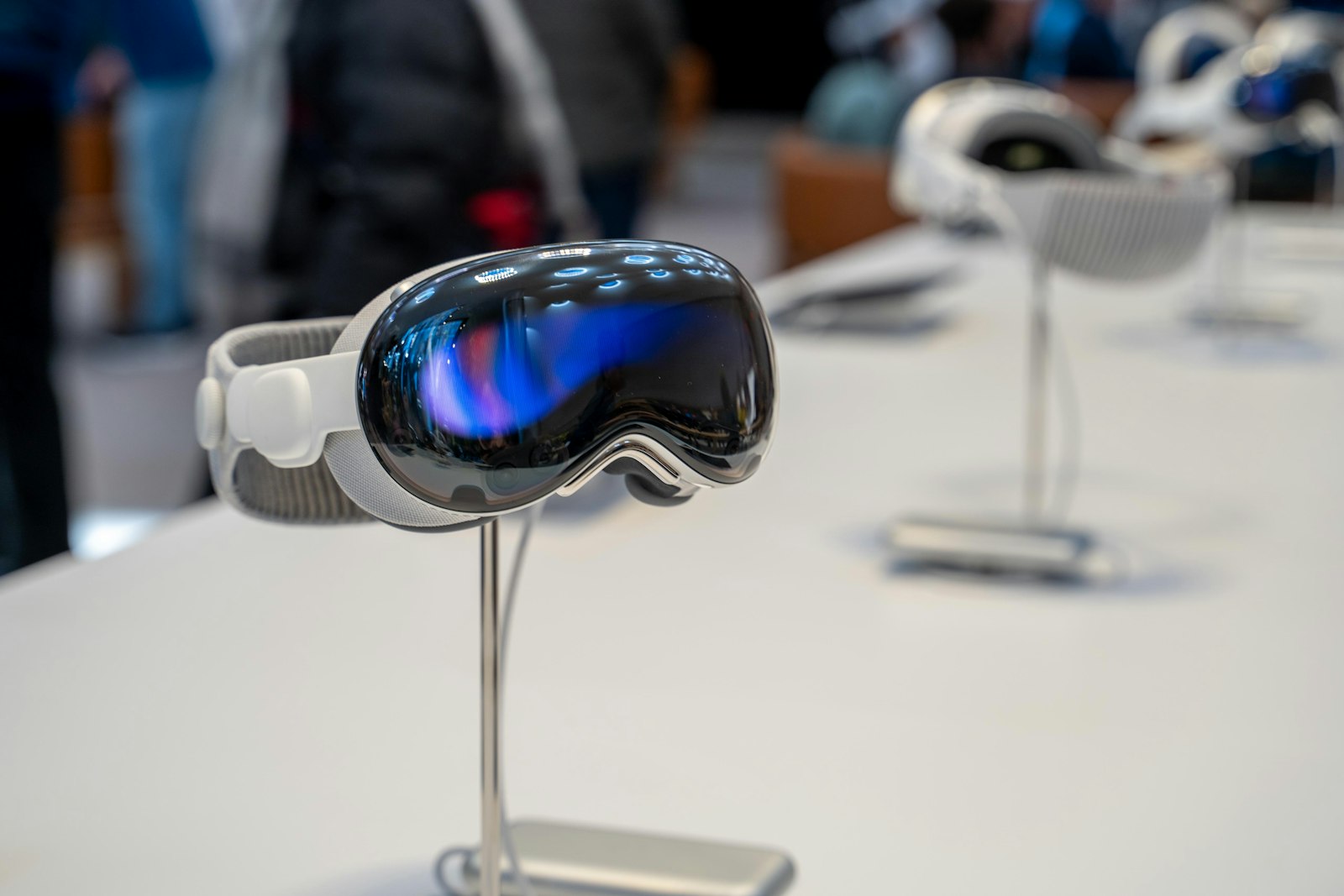 Apple Vision Pro displayed on a stand in a store