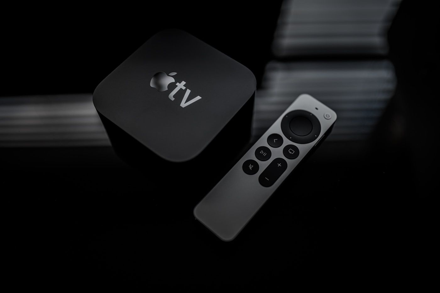 An Apple TV set-top box beside a current-generation Siri Remote. Illustrative photograph: Apple has not shown the hardware discussed here.