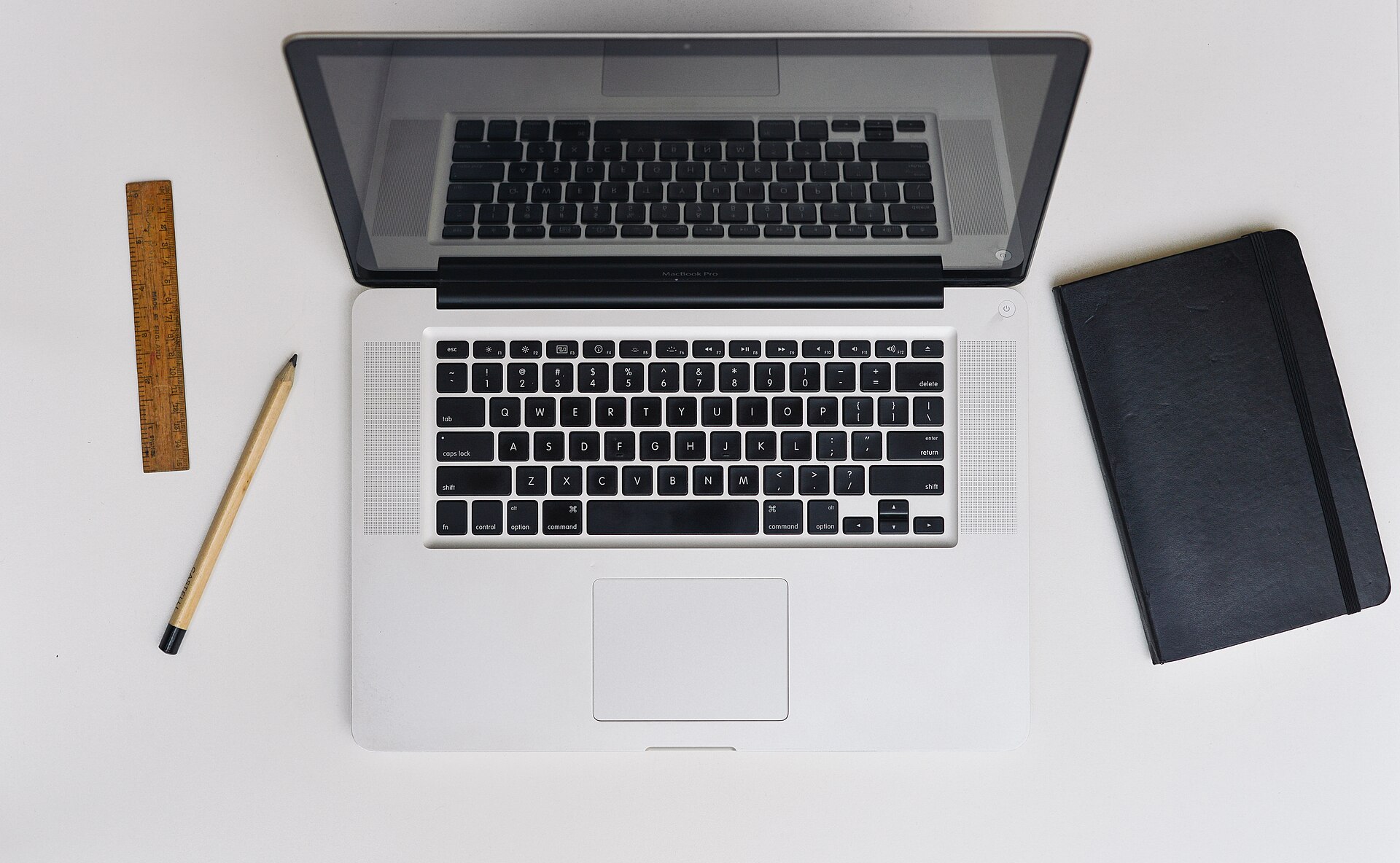 Apple MacBook Pro open on a desk, used as contextual photography for the Apple Mail and Exchange Web Services transition