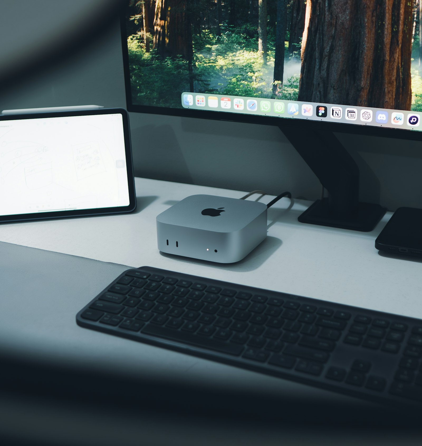 Mac Studio desktop unit on a desk with display