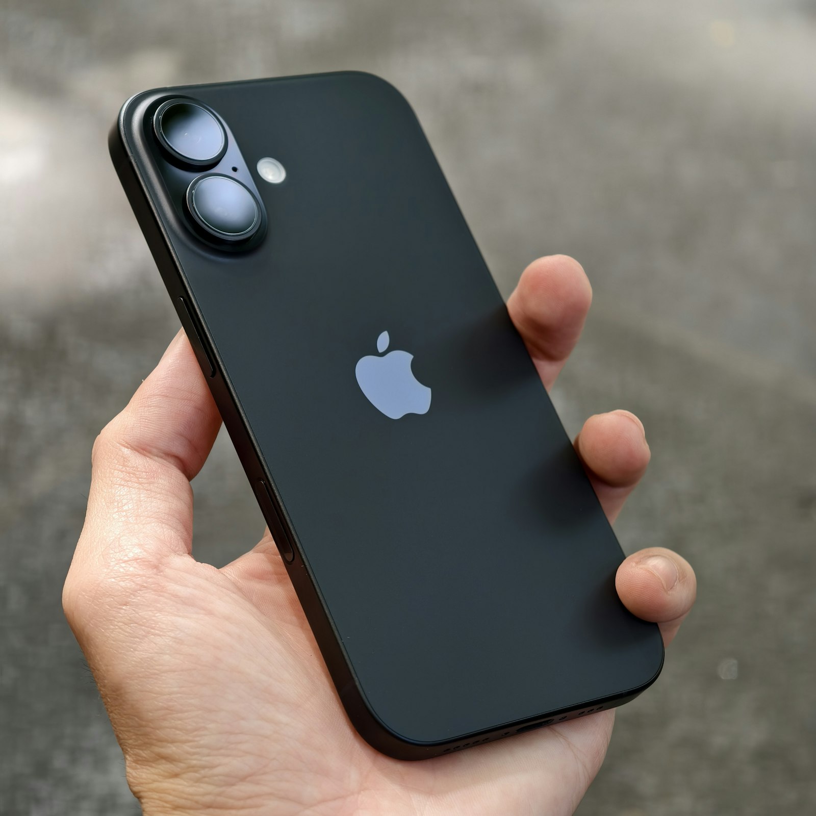 Person holding an iPhone smartphone